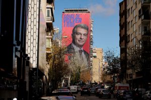 A giant electoral poster of FC Barcelona presidential hopeful Joan Laporta is seen on a building next to the Santiago Bernabeu Stadium in Madrid, Spain - December 15, 2020. REUTERS/Juan Medina